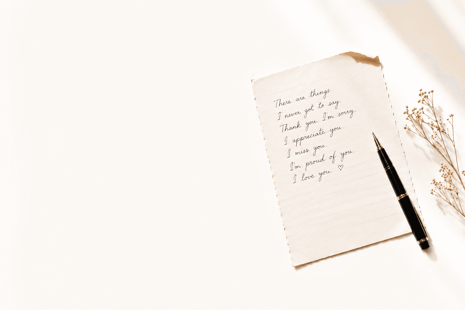 A handwritten letter on aged, lined stationery beside a black fountain pen, lit by soft morning light. It reads: There are things I never got to say. Thank you. I'm sorry. I appreciate you. I miss you. I'm proud of you. I love you.